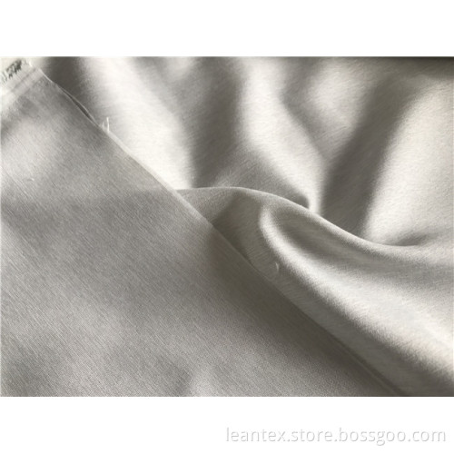 Polyester two tone melange microfiber fabric with cationic yarn
